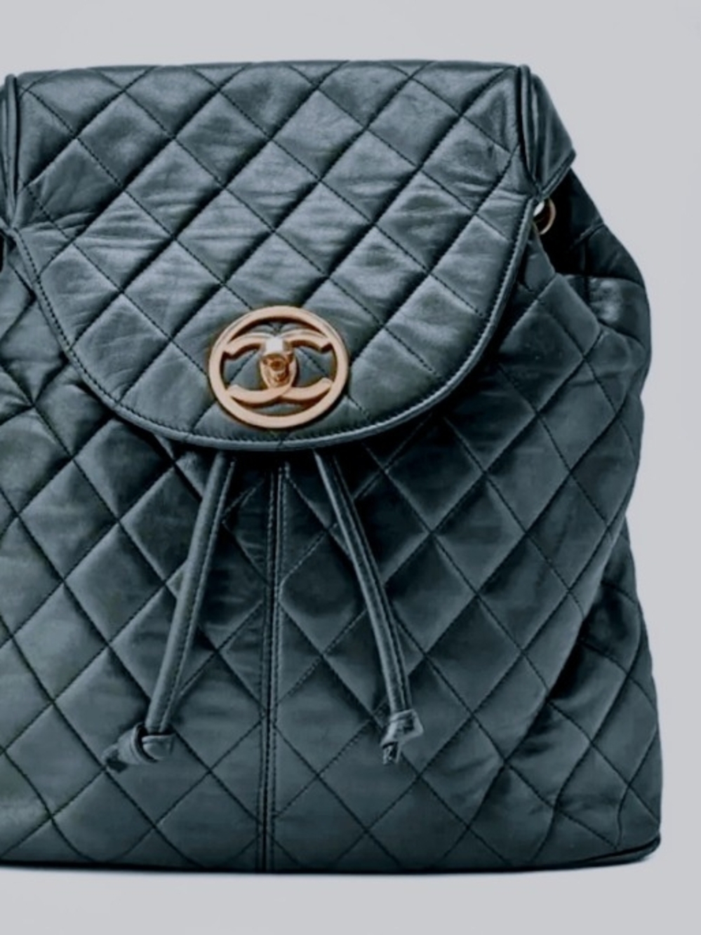 CHANEL Quilted Black Leather Drawstring Backpack with Gold CC Turnlock